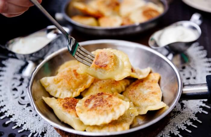 https://viapolandtravel.com/wp-content/uploads/2025/04/eating-traditional-polish-dumplings-pierogi-with-fork-1186162313-d18ccf212d134503990934c4383dddfa-1.jpg